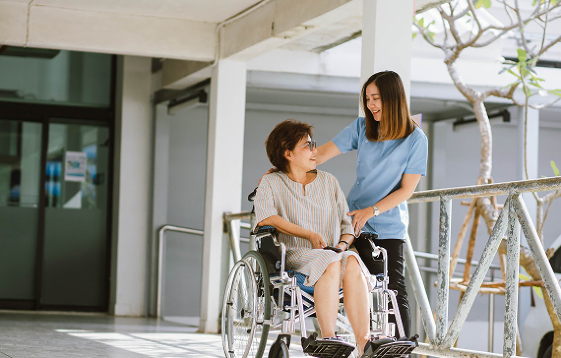 woman in wheelchair and caregiver