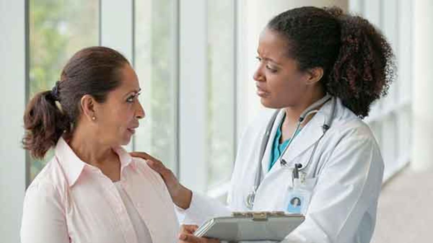 female-dr-comforting-patient-article