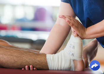 therapist manipulating patient's foot