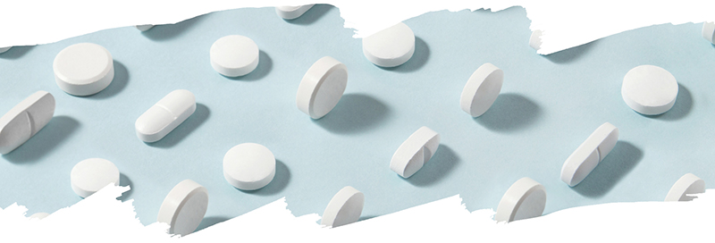 medication against a light blue background