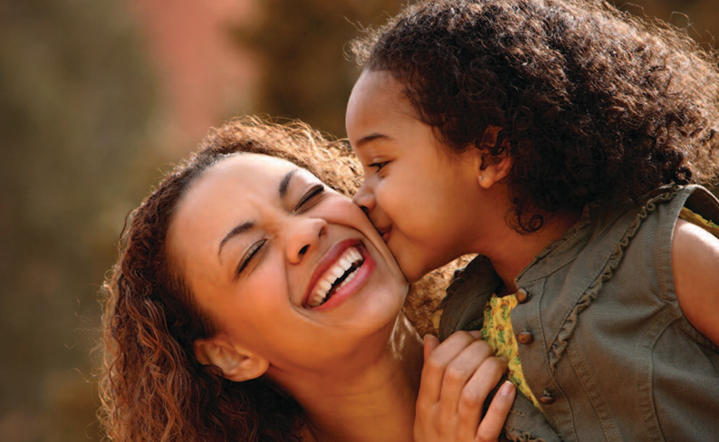 mother and daughter laughing together