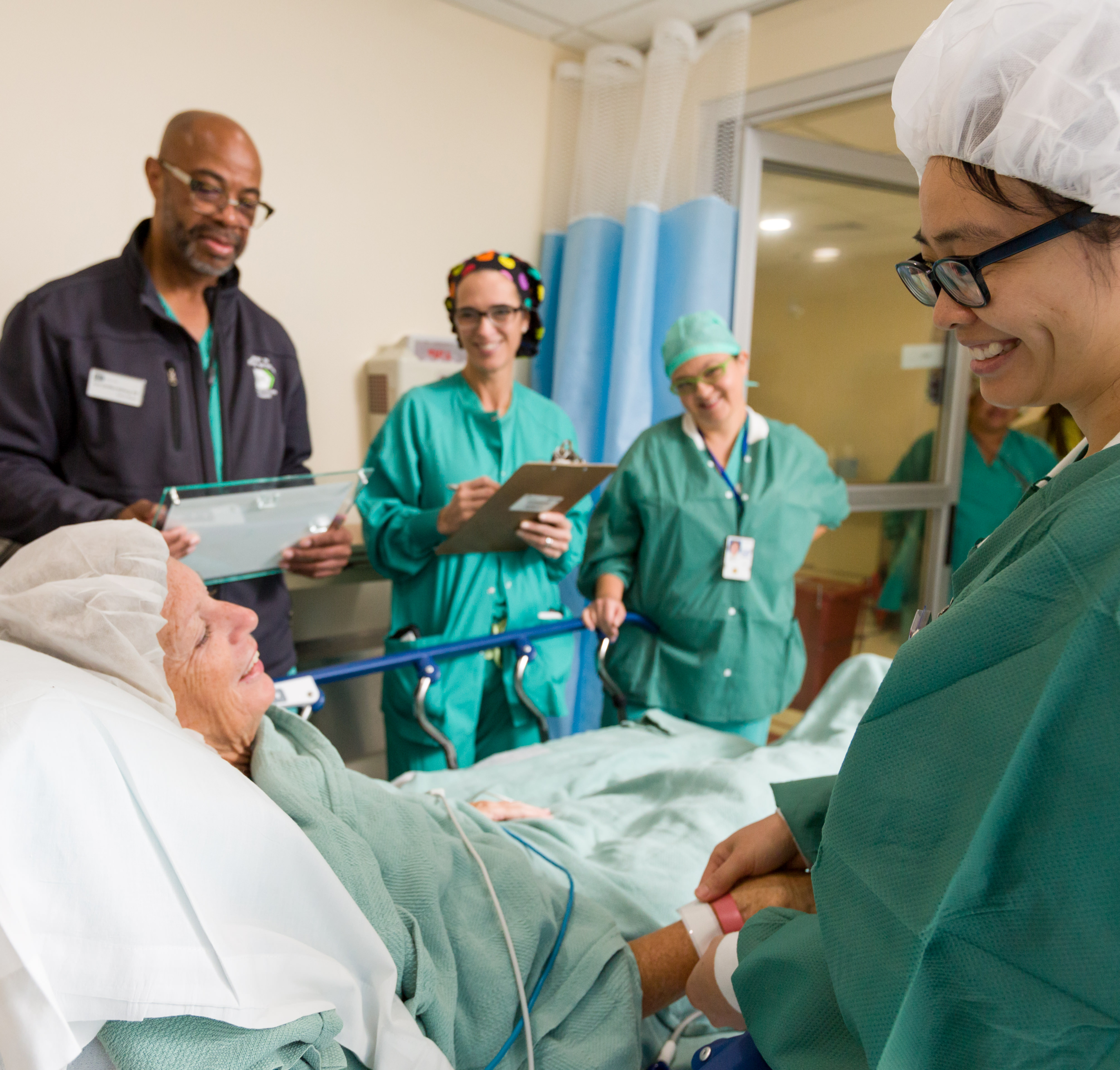 medical staff prepping a patient for surgery