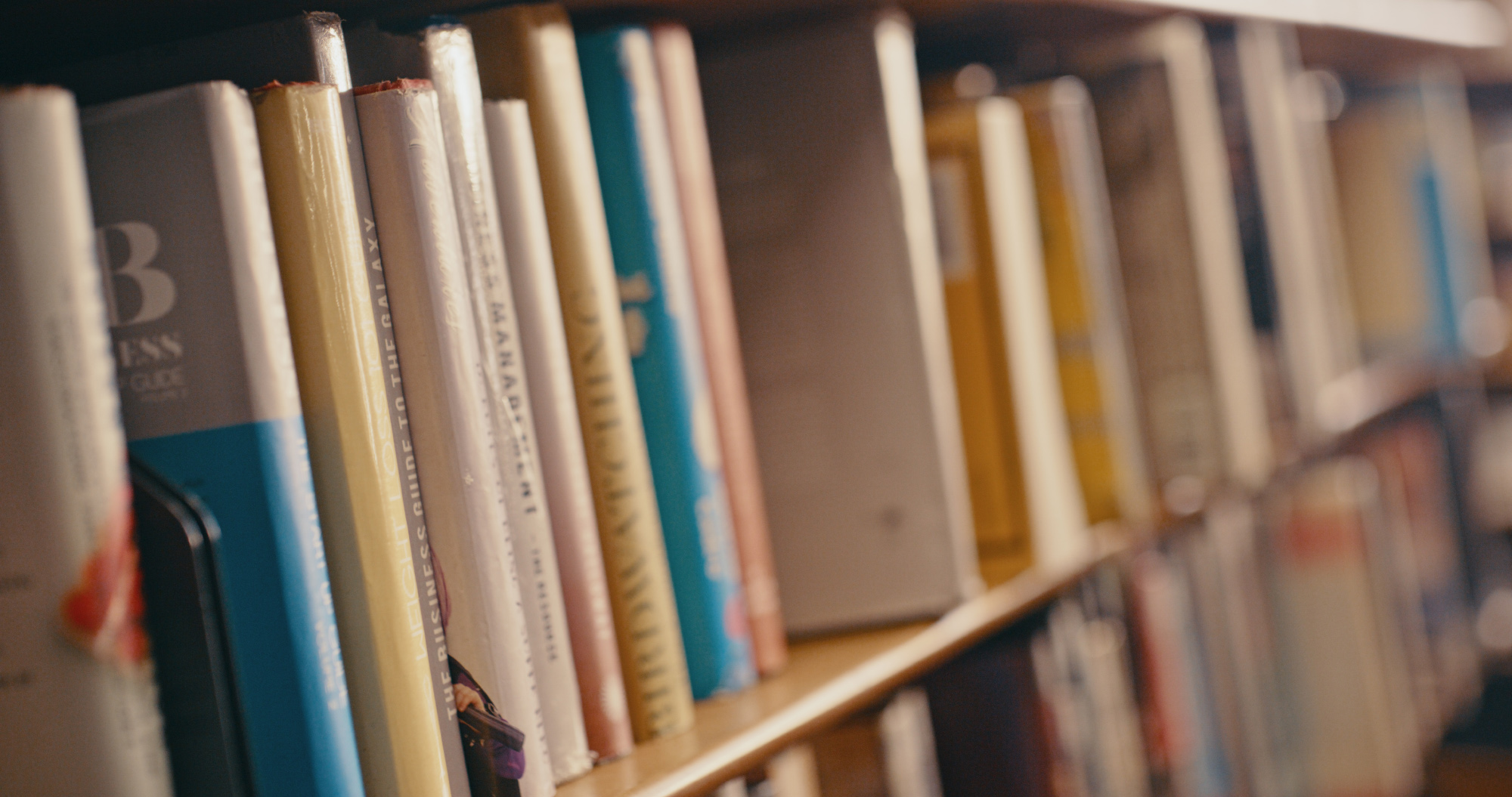A row of bookshelves filled with books.